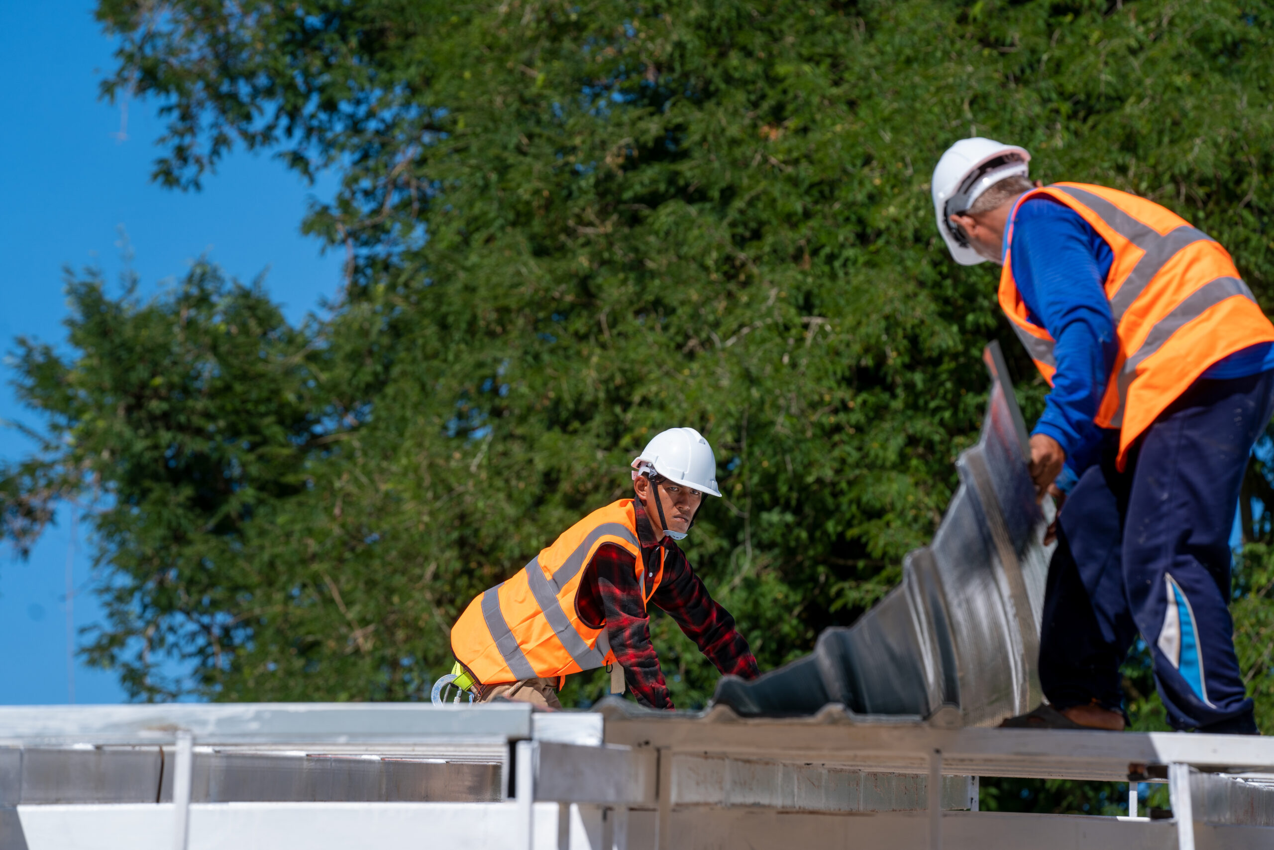 The Roofer technicians work and installing new roof structure on